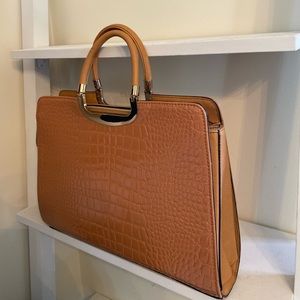 Brown hand bag with gold details